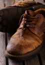 Old worn laces on brown leather boots Royalty Free Stock Photo