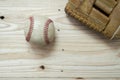 Old worn leather baseball glove and used ball on a wooden Royalty Free Stock Photo