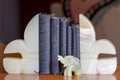 Some Christian Books: Bibles And Prayer Books Between Onyx Book Ends With An Elephant.
