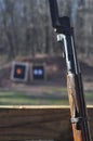 Weathered Mosin Nagant Wood Gun Rifle Stock with Bayonet Attached and Targets in the Background Royalty Free Stock Photo