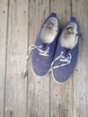Old worn out and dirty blue sneakers Royalty Free Stock Photo