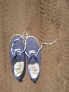 Old worn out and dirty blue sneakers Royalty Free Stock Photo