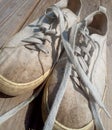 Old worn out and dirty white sneakers Royalty Free Stock Photo