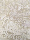 Old worn out elegant damask pattern carpet / floor covering. Luxury grunge vertical background Royalty Free Stock Photo