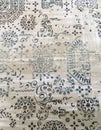 Old worn out elegant damask pattern carpet / floor covering. Luxury grunge vertical background Royalty Free Stock Photo