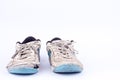 Old worn out futsal sports shoes on white background