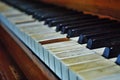 Old worn out piano close up of missing keys