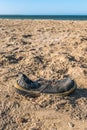 Trash shoe washed up on the beach