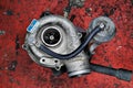 Old worn out turbocharger of a turbo diesel engine