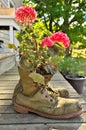 Old Worn Out Work Boots Turned into a Decorative Geranium Planter