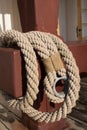 Old worn rope on a red pole Royalty Free Stock Photo