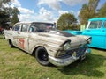Old worn rusty 1957 Ford Custom 300 V8 292 Tudor sedan hot rod on the lawn. Classic car show Royalty Free Stock Photo