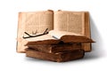 Old worn shabby jewish books in leather binding and open blurred Torah in the background. Closeup. Selective focus