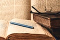 Old worn shabby jewish books, open pages of machzor and siddur. Reading Torah. Closeup. Selective focus