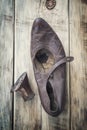 Old worn shoes on a wooden table Royalty Free Stock Photo