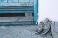 Old worn sneakers on the street Royalty Free Stock Photo