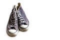 Old worn sneakers on white background Royalty Free Stock Photo