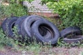 Old worn tires are a big pile in a landfill