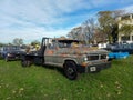 Old worn unpainted 1960s Ford F 350 Diesel flatbed pickup truck on the lawn. Classic car show Royalty Free Stock Photo