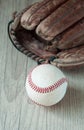 Old and worn used leather baseball sport glove over aged Royalty Free Stock Photo