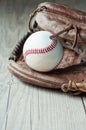 Old and worn used leather baseball sport glove over aged Royalty Free Stock Photo