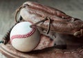 Old and worn used leather baseball sport glove over aged Royalty Free Stock Photo