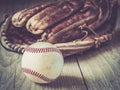 Old and worn used leather baseball sport glove over aged Royalty Free Stock Photo