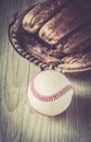 Old and worn used leather baseball sport glove over aged Royalty Free Stock Photo