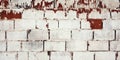 Old Worn Vintage Brick Wall with Peeling Plaster Texture. Grungy red Stonewall Background. Abstract Web Banner Royalty Free Stock Photo