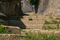 Old, worn vintage stone steps in Porto, Portugal with grass growing in cracks Royalty Free Stock Photo