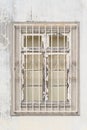 Old worn window with bars