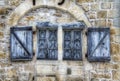 An Old, Worn Window in Turenne, France
