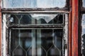 Old worn window with wooden frame