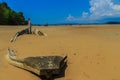 Old wreck fishing boat buried in the sand with blue sky on cloud Royalty Free Stock Photo