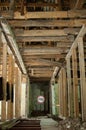 Old wrecked house with 'Danger' in English and in Ukrainian warning sign, abandoned building, uninhabitable place