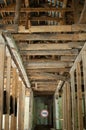 Old wrecked house with 'Danger' in English and in Ukrainian warning sign, abandoned building, uninhabitable place