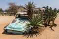 Old wrecks of rusty cars decorate the Solitaire station in Namibia Royalty Free Stock Photo