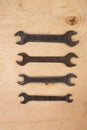 Old wrench spanner, instrument, equipment for job on wooden background