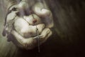 Old wrinkled woman hands holding a rosary. Closeup of christian  woman hands holding rosary while praying God Royalty Free Stock Photo