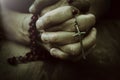 Old wrinkled woman hands holding a rosary. Closeup of christian  woman hands holding rosary while praying God Royalty Free Stock Photo