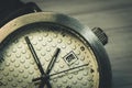 An old wristwatch with a scratched glass close-up Royalty Free Stock Photo