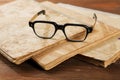 Old writing-books and glasses on table Royalty Free Stock Photo