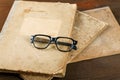 Old writing-books and glasses on a table Royalty Free Stock Photo