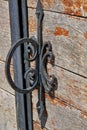Old wrought iron door handle. Royalty Free Stock Photo