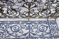 Old wrought iron railing on a walkway with shadow on the floor Royalty Free Stock Photo