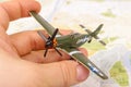 Old WWII model plane in the male hand Royalty Free Stock Photo