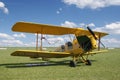 An old yellow biplane airplane from the early 20th century. Royalty Free Stock Photo