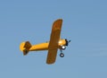 Old yellow biplane in flight Royalty Free Stock Photo