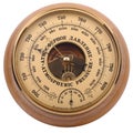 Old yellow-brown aneroid barometer in wooden body on a white Royalty Free Stock Photo