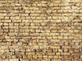 Old yellow brown brick wall background texture. Brick wall of historical bricks Royalty Free Stock Photo